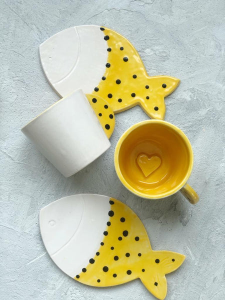 Yellow polka dot coffee cup and fish bottom